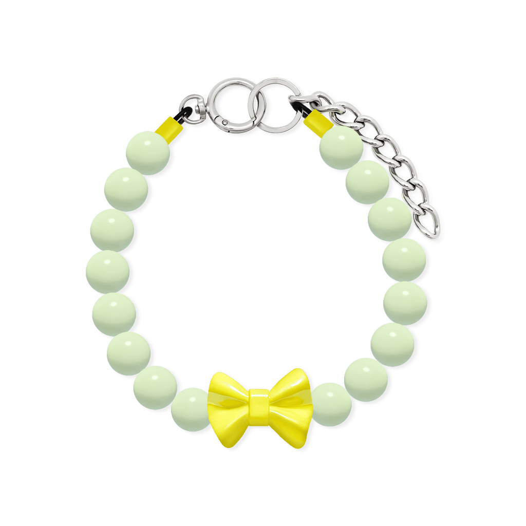 JOGIA glow-in-the-dark beaded dog collar with pale green beads, yellow bow charm, and extension chain.